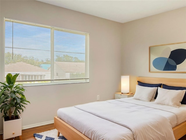 bedroom with wood-type flooring