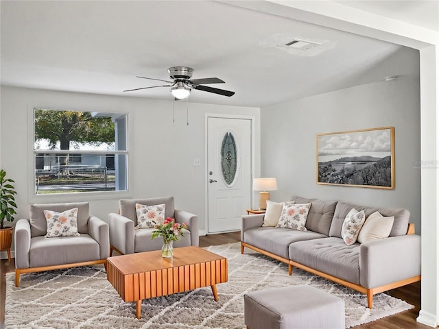 living room with hardwood / wood-style flooring and ceiling fan