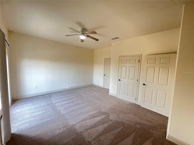 unfurnished bedroom with carpet flooring and ceiling fan