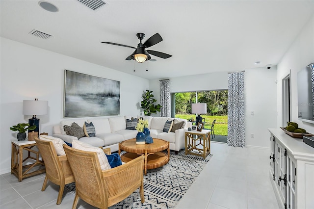 living room with ceiling fan and light tile patterned flooring