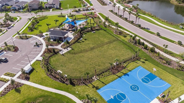 birds eye view of property with a water view