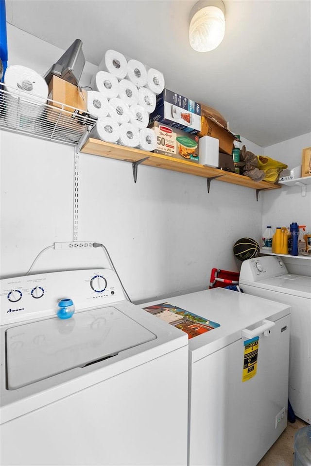 clothes washing area featuring independent washer and dryer