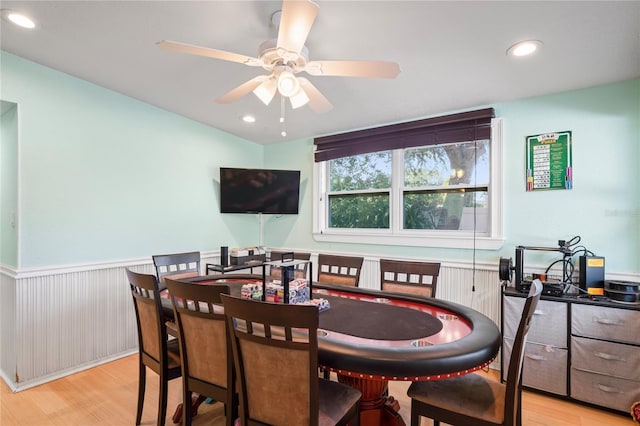 dining room with ceiling fan and light hardwood / wood-style flooring