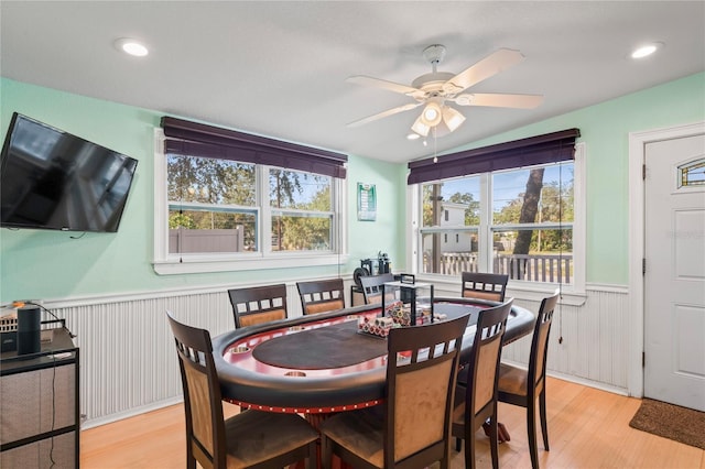 dining room with ceiling fan, light hardwood / wood-style floors, and a wealth of natural light