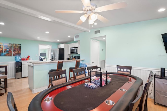 dining space featuring light hardwood / wood-style flooring and ceiling fan