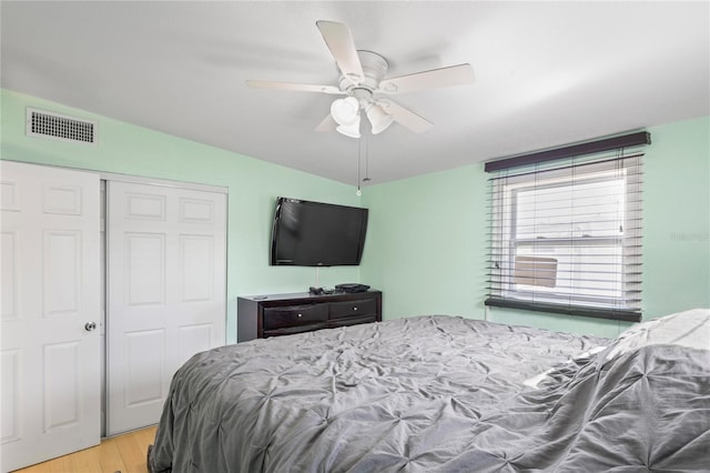 bedroom featuring a closet, ceiling fan, and light hardwood / wood-style flooring