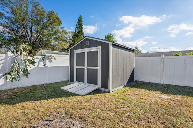 view of outdoor structure featuring a lawn