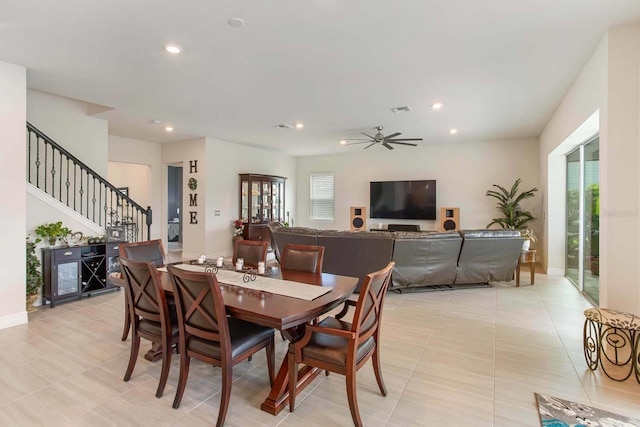 tiled dining area featuring ceiling fan