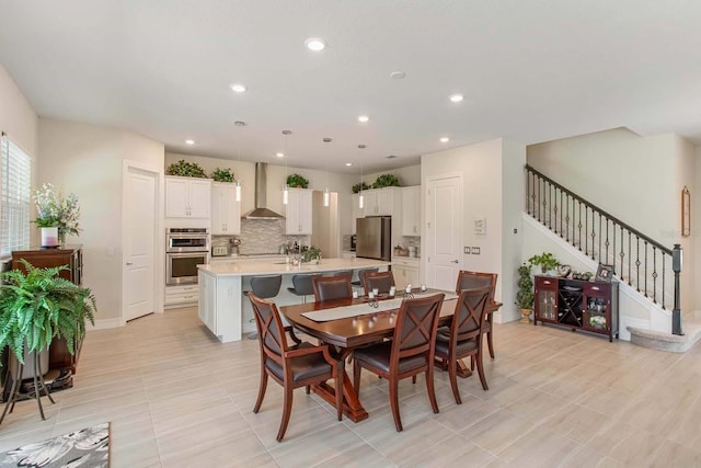 dining space featuring light tile patterned floors