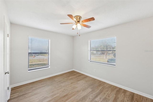 unfurnished room with ceiling fan and light hardwood / wood-style floors