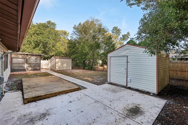 view of patio featuring a shed