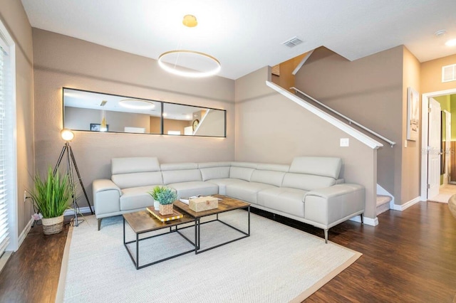 living room with dark hardwood / wood-style floors