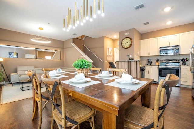 dining room featuring dark hardwood / wood-style flooring