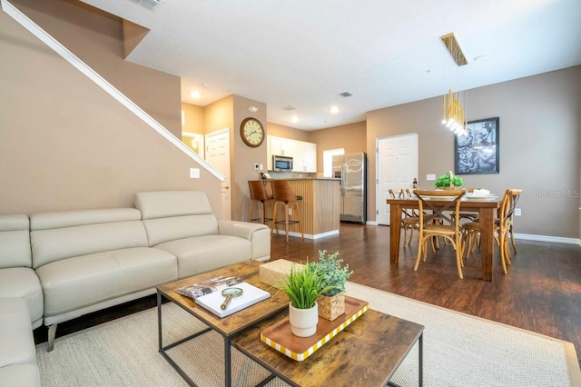 living room featuring dark hardwood / wood-style floors