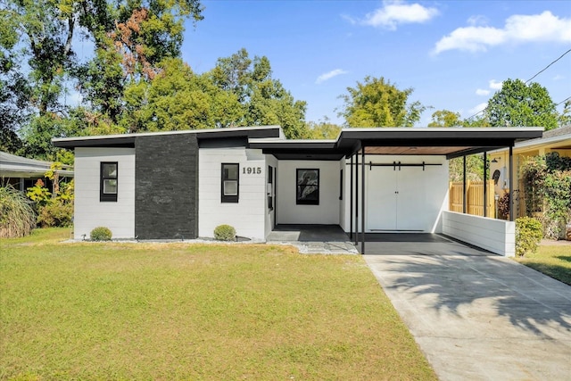 contemporary house with a carport and a front yard