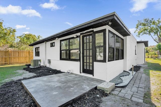 back of house featuring a patio and central air condition unit