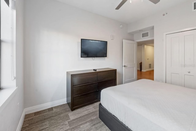 bedroom with ceiling fan and a closet