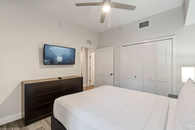 bedroom with ceiling fan and a closet