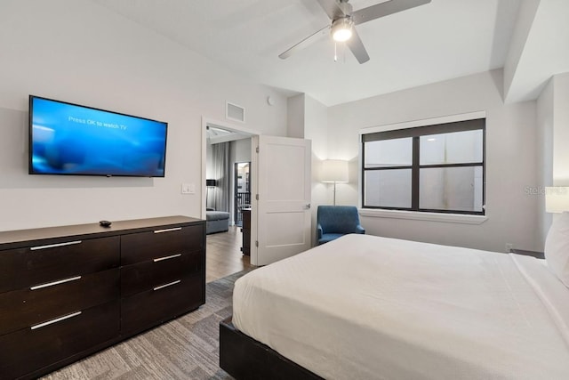 bedroom featuring ceiling fan and light hardwood / wood-style floors