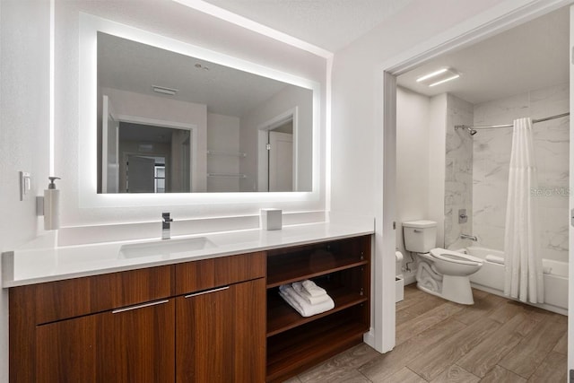 full bathroom with shower / bathtub combination with curtain, a textured ceiling, toilet, vanity, and hardwood / wood-style flooring