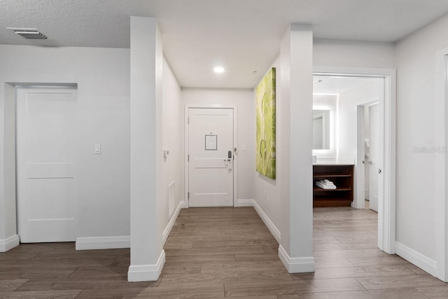 hall featuring wood-type flooring