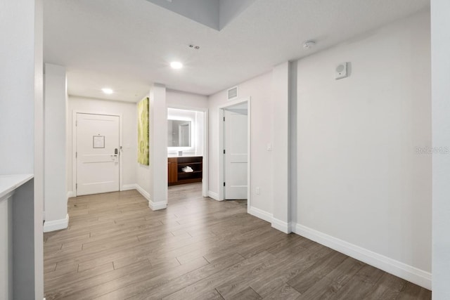 spare room featuring light hardwood / wood-style flooring