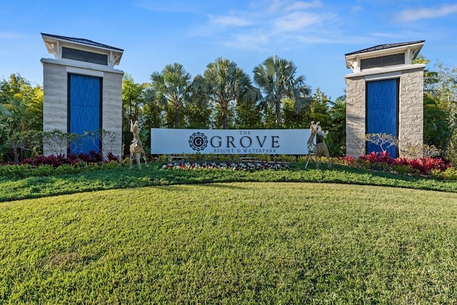 community sign featuring a yard