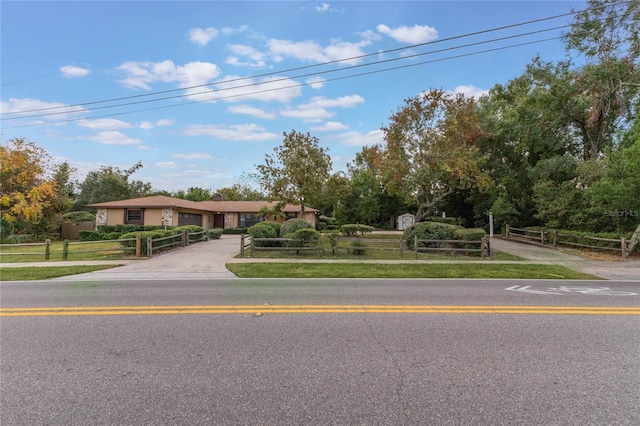 view of front of house featuring a gate and fence