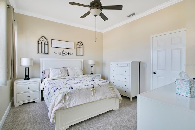 carpeted bedroom with ceiling fan and crown molding