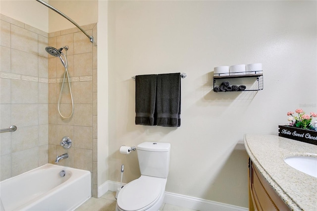 full bathroom with tile patterned floors, toilet, vanity, and tiled shower / bath