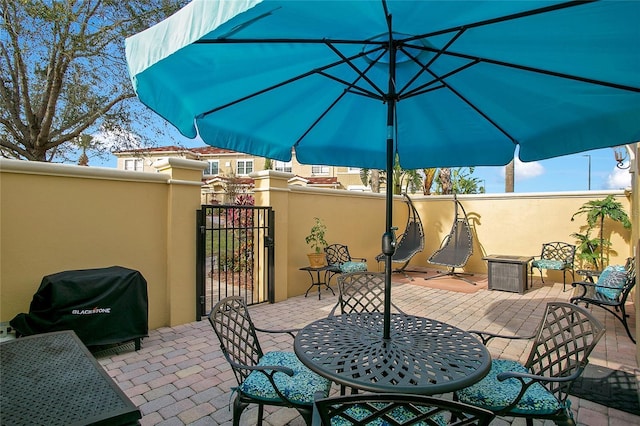 view of patio featuring a grill