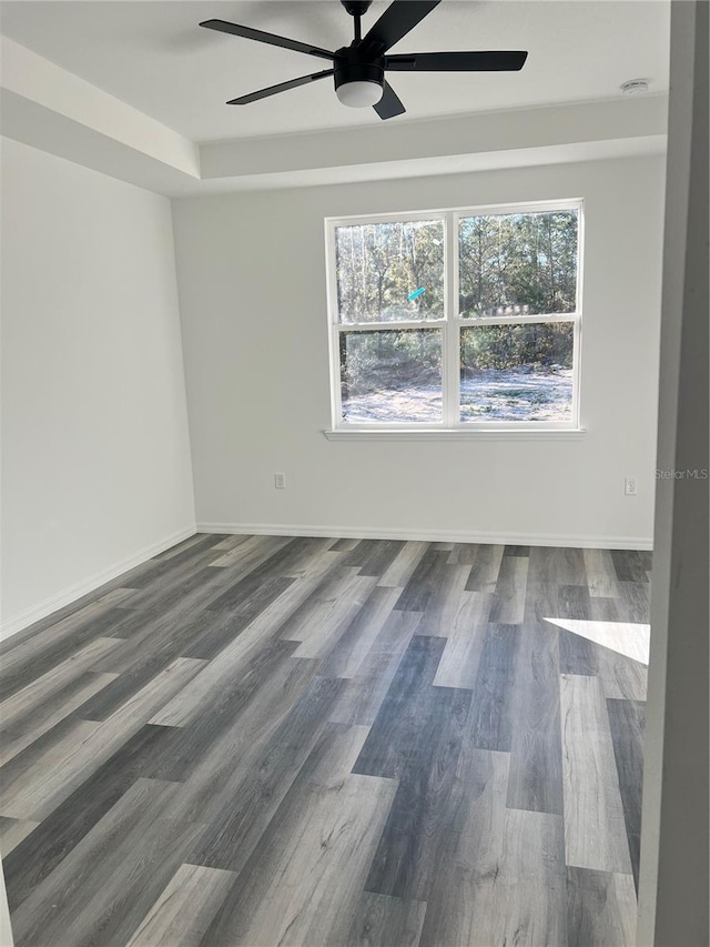 unfurnished room featuring ceiling fan and hardwood / wood-style floors