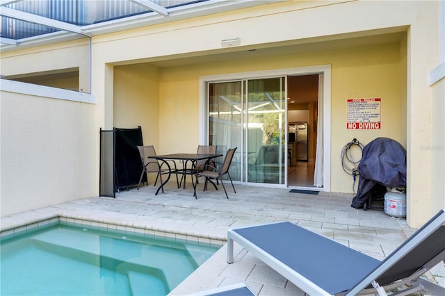 view of swimming pool with a patio area