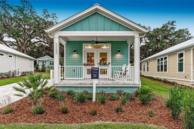 view of front of property featuring ac unit, a porch, and ceiling fan