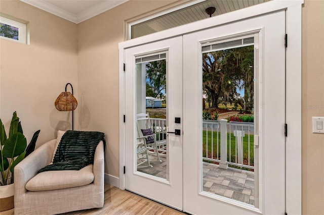 12133 Grand Oak Ln, Oxford, FL 34484 - doorway to outside featuring french doors, ornamental molding, and light hardwood / wood-style flooring