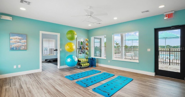 12133 Grand Oak Ln, Oxford, FL 34484 - exercise room with ceiling fan and hardwood / wood-style flooring