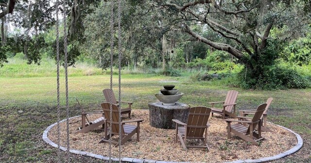 12133 Grand Oak Ln, Oxford, FL 34484 - view of yard featuring a fire pit