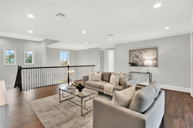 living area featuring recessed lighting, visible vents, baseboards, and wood finished floors