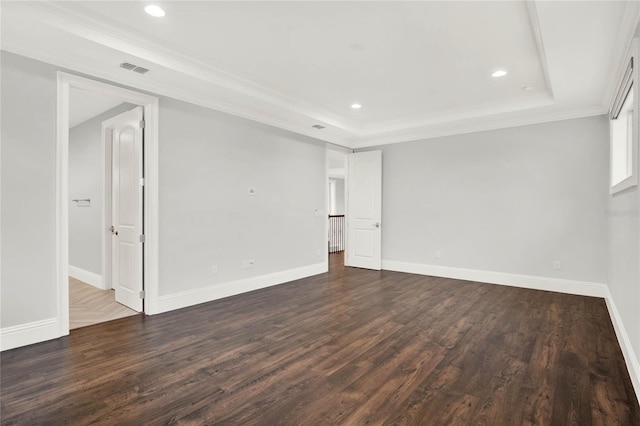 unfurnished room with baseboards, a raised ceiling, and dark wood-style flooring