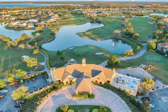 birds eye view of property with a residential view, a water view, and golf course view