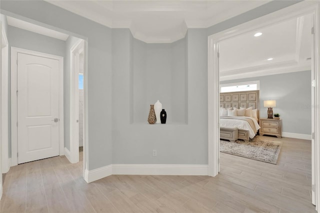 bedroom with ornamental molding, recessed lighting, light wood-style flooring, and baseboards