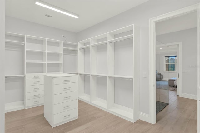 spacious closet featuring wood finish floors