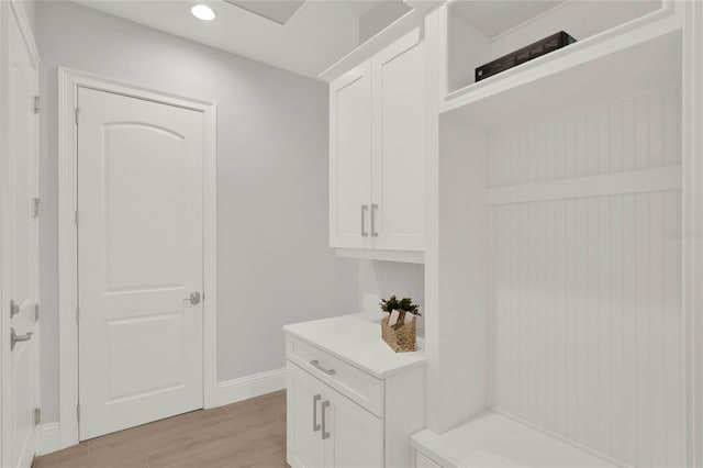 mudroom with light wood-style floors, baseboards, and recessed lighting