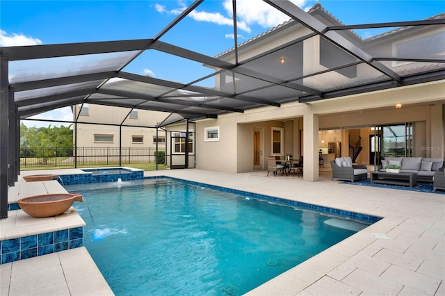 view of pool with an outdoor hangout area, a patio area, a lanai, and a pool with connected hot tub