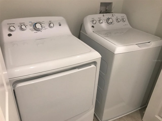 clothes washing area featuring washing machine and dryer