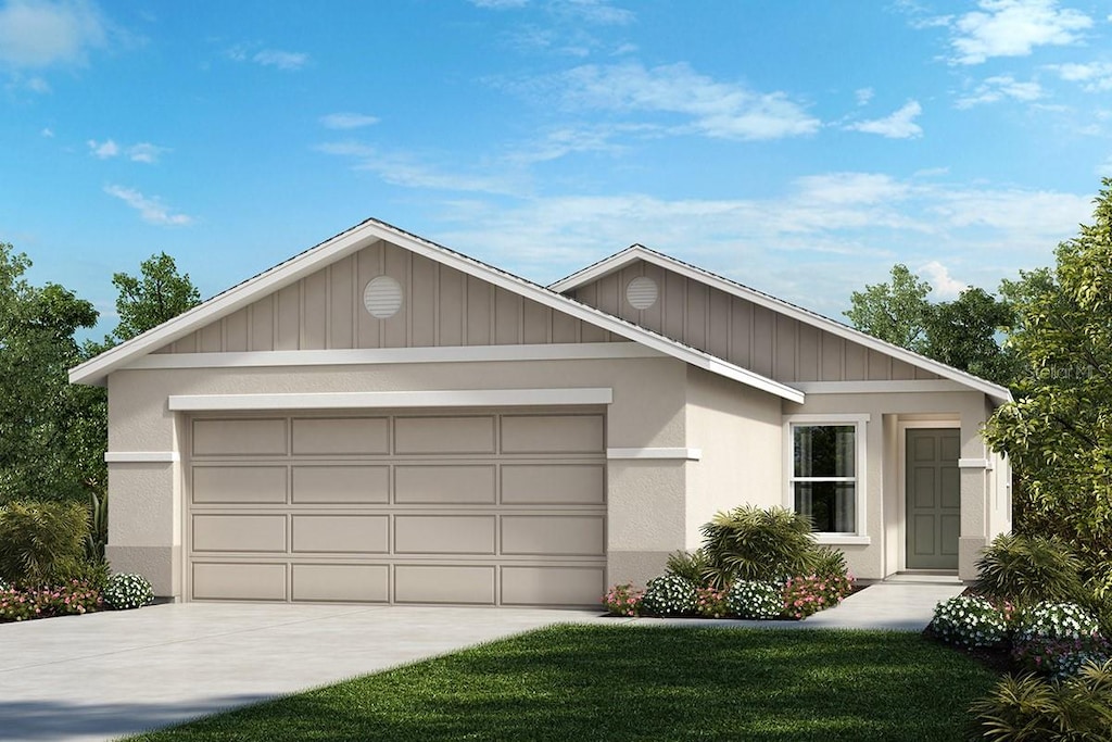 ranch-style home with a garage and a front yard