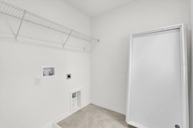 clothes washing area with baseboards, laundry area, hookup for a washing machine, and hookup for an electric dryer