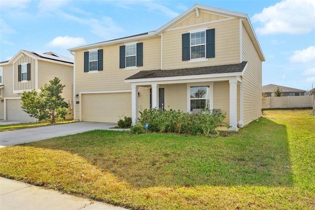 view of front of home with solar panels, a garage, and a front lawn