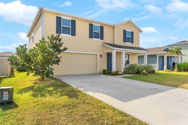 view of front of property with a front yard and a garage