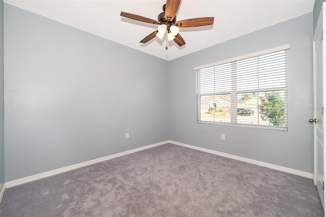 empty room featuring carpet and ceiling fan